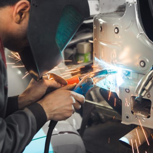 Industrial,Worker,At,Car,Service,Welds,Automotive,Body.,Metalworking,With Industrial,Worker,At,Car,Service,Welds,Automotive,Body.,Metalworking,With